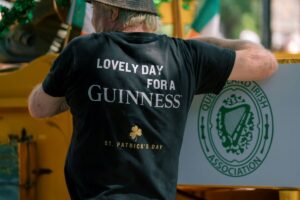A business owner dressed up for Saint Patrick's Day, one of the most profitable business days for restaurants and bars. 
